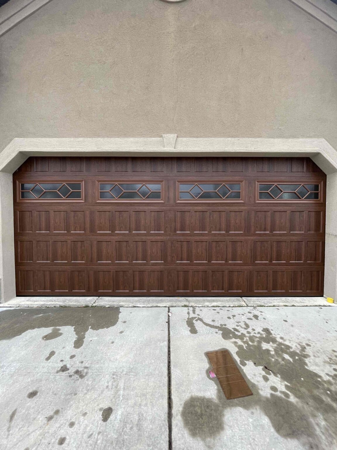 Garage Door Installation in Orem Utah . Amarr 16 x 7'6 Heritage 1000, Recessed Panel Design, Color: Woodgrain Walnut, windows: Waterford w/Obscure glass